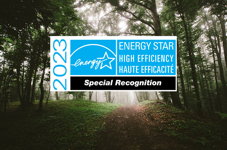 The Special Recognition 2023 logo from ENERGY STAR Canada on a foresty background.