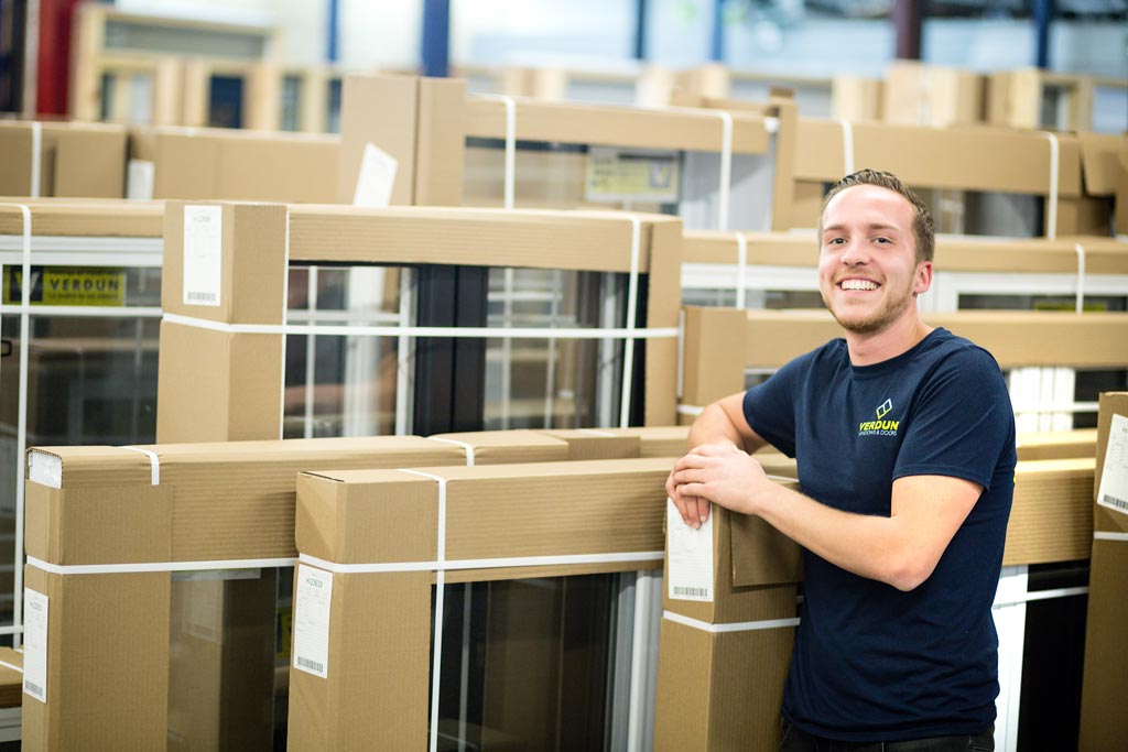 Verdun window manufacturer standing in front of windows ready to be installed.