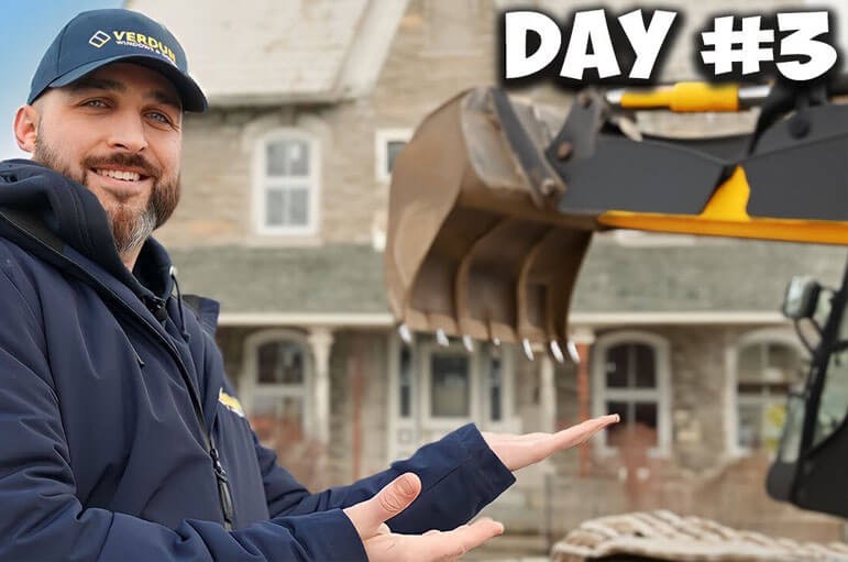 A Verdun sales rep poses in front of a classic, vintage home in Crysler, ON.